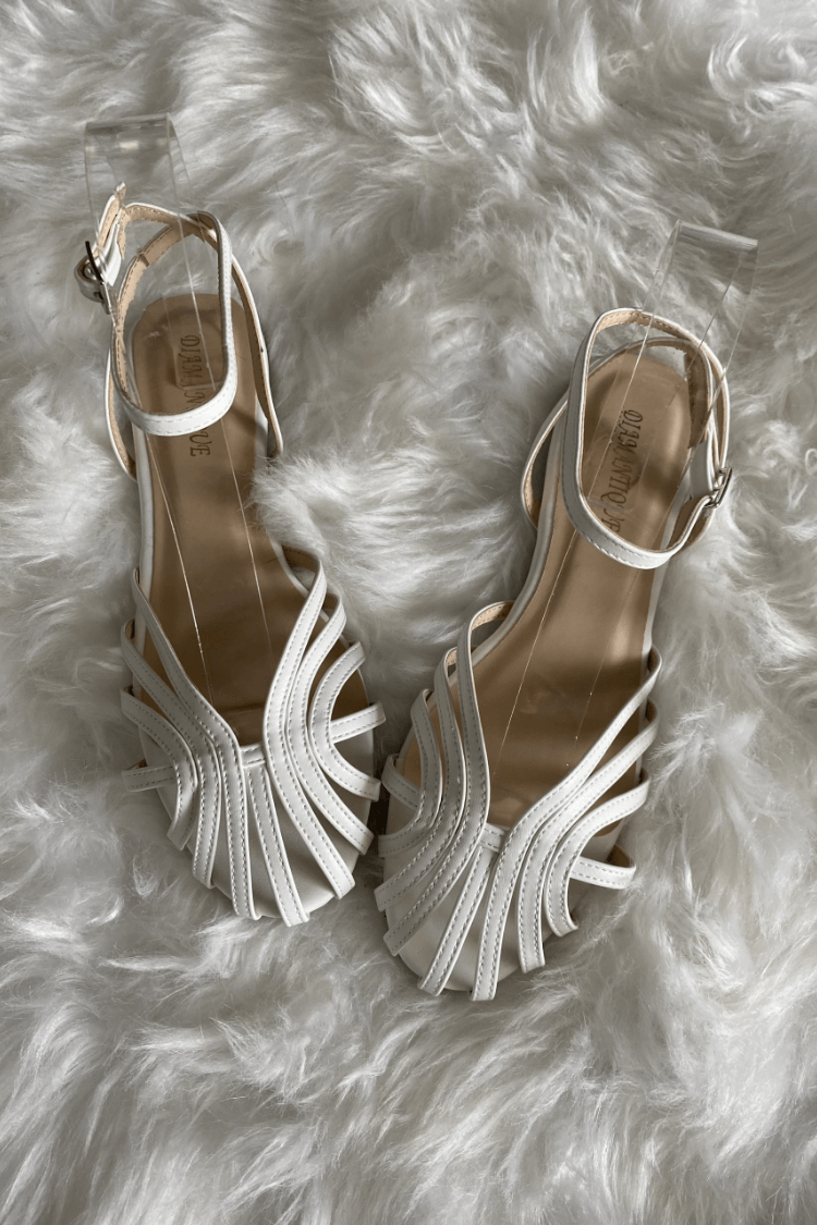 SOLE - Elegant flat woven sandals for a sophisticated look