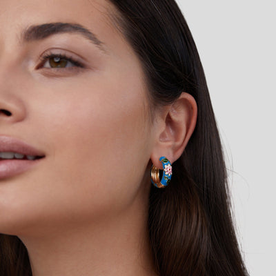 Gold circle earrings with flower