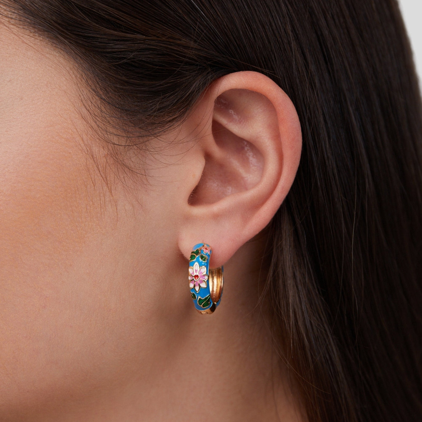 Gold circle earrings with flower