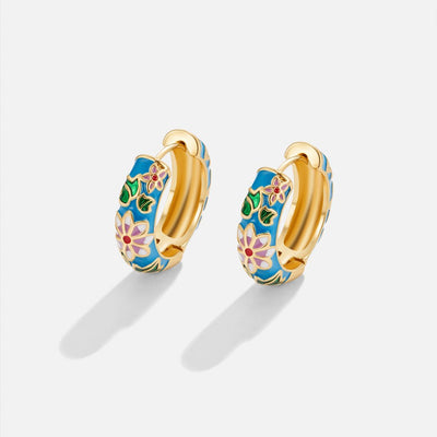 Gold circle earrings with flower