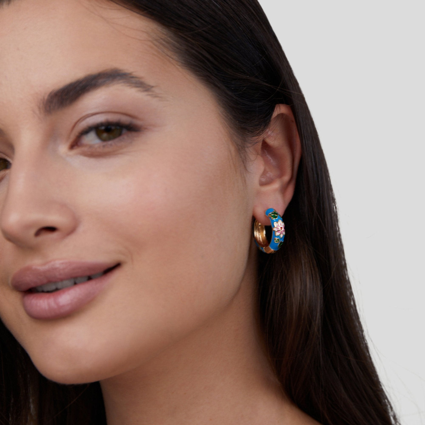 Gold circle earrings with flower